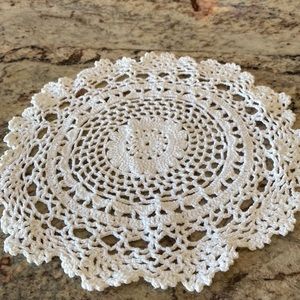 Vintage Victorian handcrafted crochet doily . Has flower in the center.